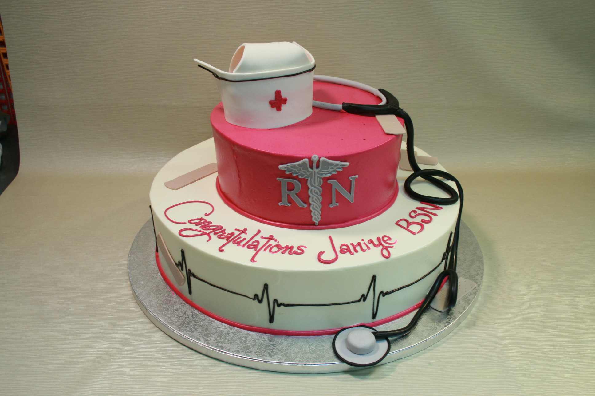 The doctor or nurse holds a large birthday cake, congratulations on the day  of the doctor or nurse Stock Photo - Alamy